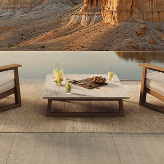 Tan Guor Desert patio with table, drinks, and mountain view.