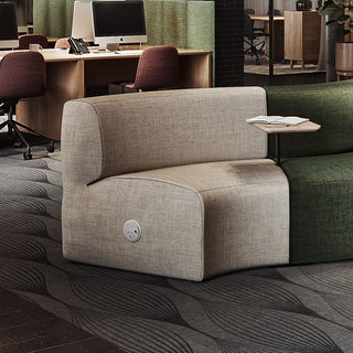 Beige and green sectional sofa in office.