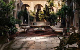 Outdoor seating area with sofa and coffee table.