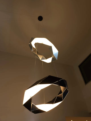 Two geometric pendant lights hanging from the ceiling.