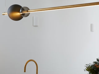 Modern brass pendant light fixture in interior design (1547_0078)