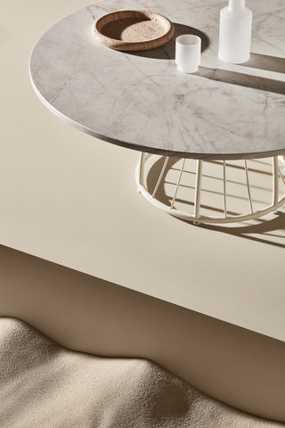 ND coffee table with decorative items on a neutral background