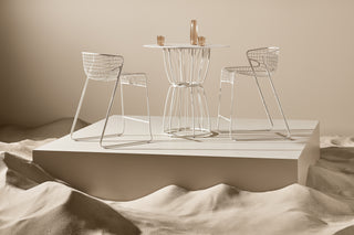 ND bar stools and table set against a neutral background