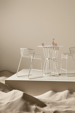 ND cropped bar stools and table on a neutral background
