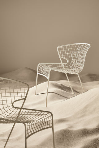ND chairs on a textured surface with a neutral background