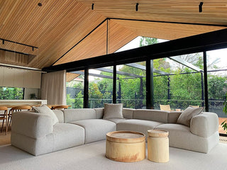 Modern living room with wood ceiling and large sectional sofa