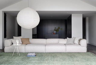 Modern living room with white sofa and paper lantern