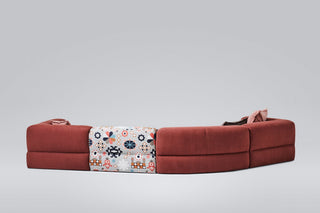 Modern red sectional sofa with patterned cushion