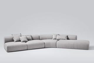 Gray sectional sofa with pillows.