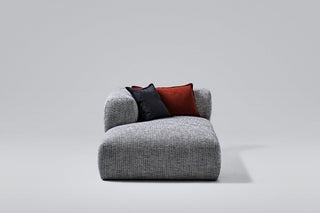 Gray sofa with two pillows.