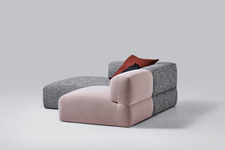 Modern pink and gray sectional sofa with red pillow