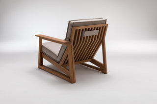 Wooden outdoor chair with cushions.
