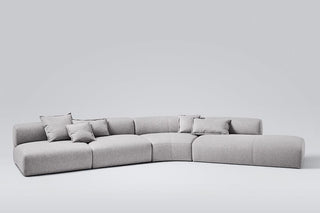 Gray sectional sofa with pillows.