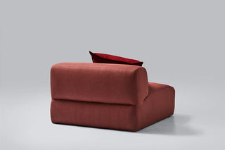Red modern sofa with red pillow.