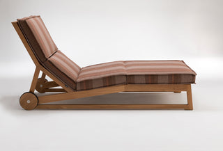 Wooden chaise lounge with striped cushions.