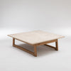 Square coffee table with light wood top and legs.