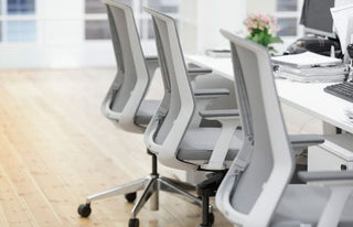 Advanta Aveya task chairs with white frame and grey mesh in office setting