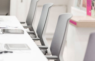 Advanta Aveya task chairs with white frame and grey mesh in situ