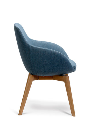 Blue upholstered chair with wooden legs on a white background