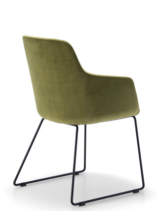 Green chair with black metal legs on a white background