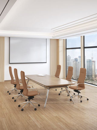 Modern conference room with a large wooden table and Million tan high back chairs in front of a cityscape view.