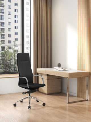 Modern office setup with a Million high back chair and wooden desk by a window with cityscape view.