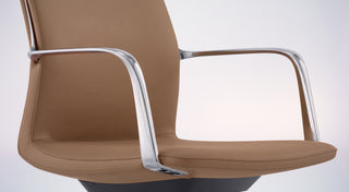 Million high back tan detail with metal frame on a white background