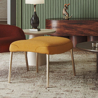 Yellow upholstered footstool with gold legs
