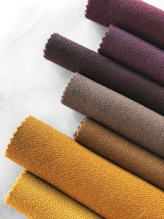 Rolled fabric samples in various shades, Atlas collection