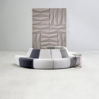 AuraLight sofa 3rd angle view with geometric wall decor.