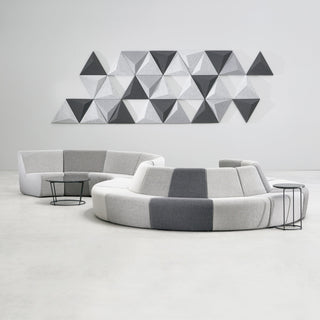 AuraLightNew2 - Modern office seating with geometric wall art.
