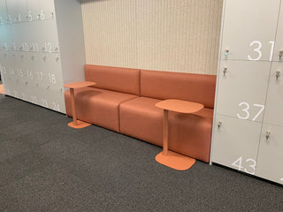 Infosys banquet seating area with coral sofa and tables