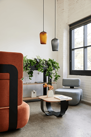 Modern office interior with plants and pendant lights