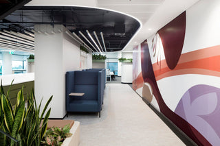 Catapult Infosys Connected Booth interior with seating and mural.