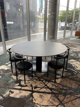 Round table with chairs in a modern interior.