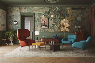 Stylish living room with colorful chairs and floral wallpaper