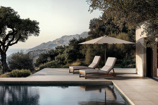 Tan Guor Residence I swimming pool with lounge chairs and umbrella