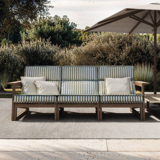 Tan Guor Residence I outdoor patio with striped sofa