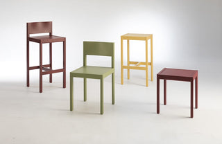 assorted colorful chairs and stools