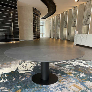 Modern round table in interior space.