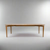 Wooden dining table on a grey background