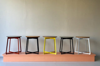 Five colorful stools on display