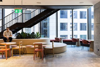 GEYER 201 George St office interior with seating and man