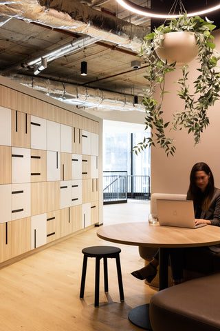 GEYER 201 George office space with woman working at table.