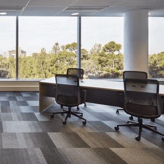 Graphite office with modern chairs and window view