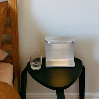 Table with lamp and glass.