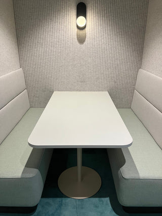 Office booth with table and seating, edited.