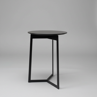 Black side table on a gray background