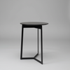 Black side table on a gray background