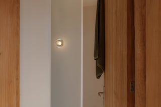 Modern wall sconce in hallway